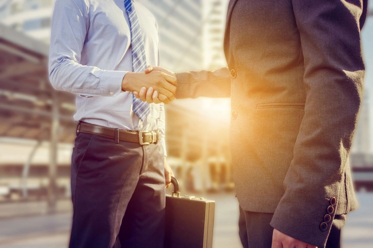 Business professionals shaking hands