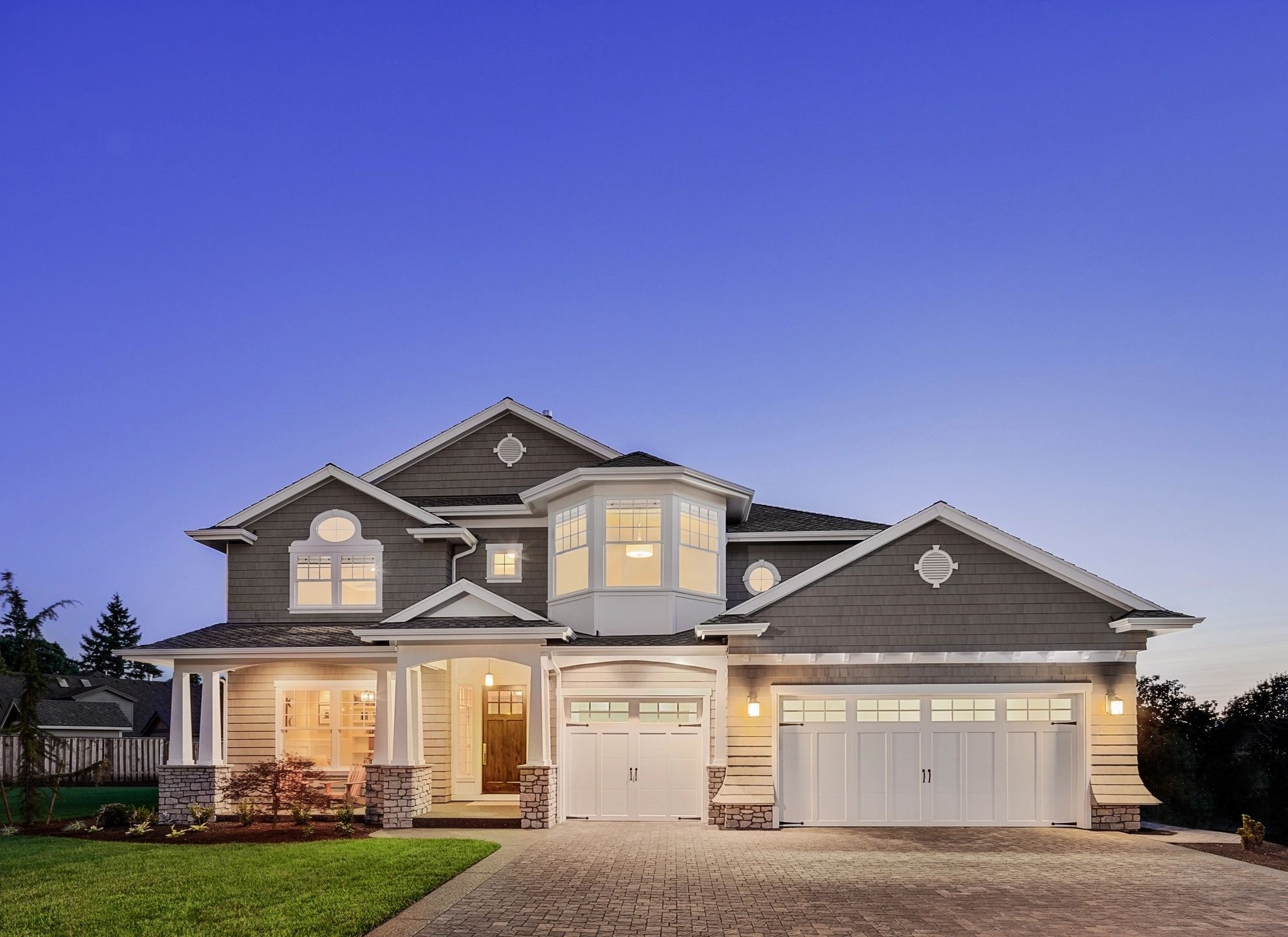 Modern two-story residential home at twilight